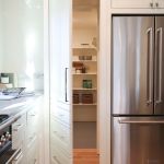 Laundry room turned into hidden pantry with custom built cabinetry on HGTV Fixer to Fabulous.