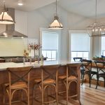 The Kitchen is the heart of the home with island and custom built dining table.