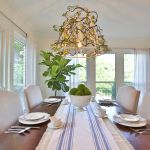 Iron balconies transformed into chandelier over dining table.