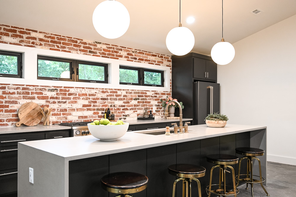 HGTV Fixer to Fabulous Kitchen Renovation with brick backsplash and large kitchen island.