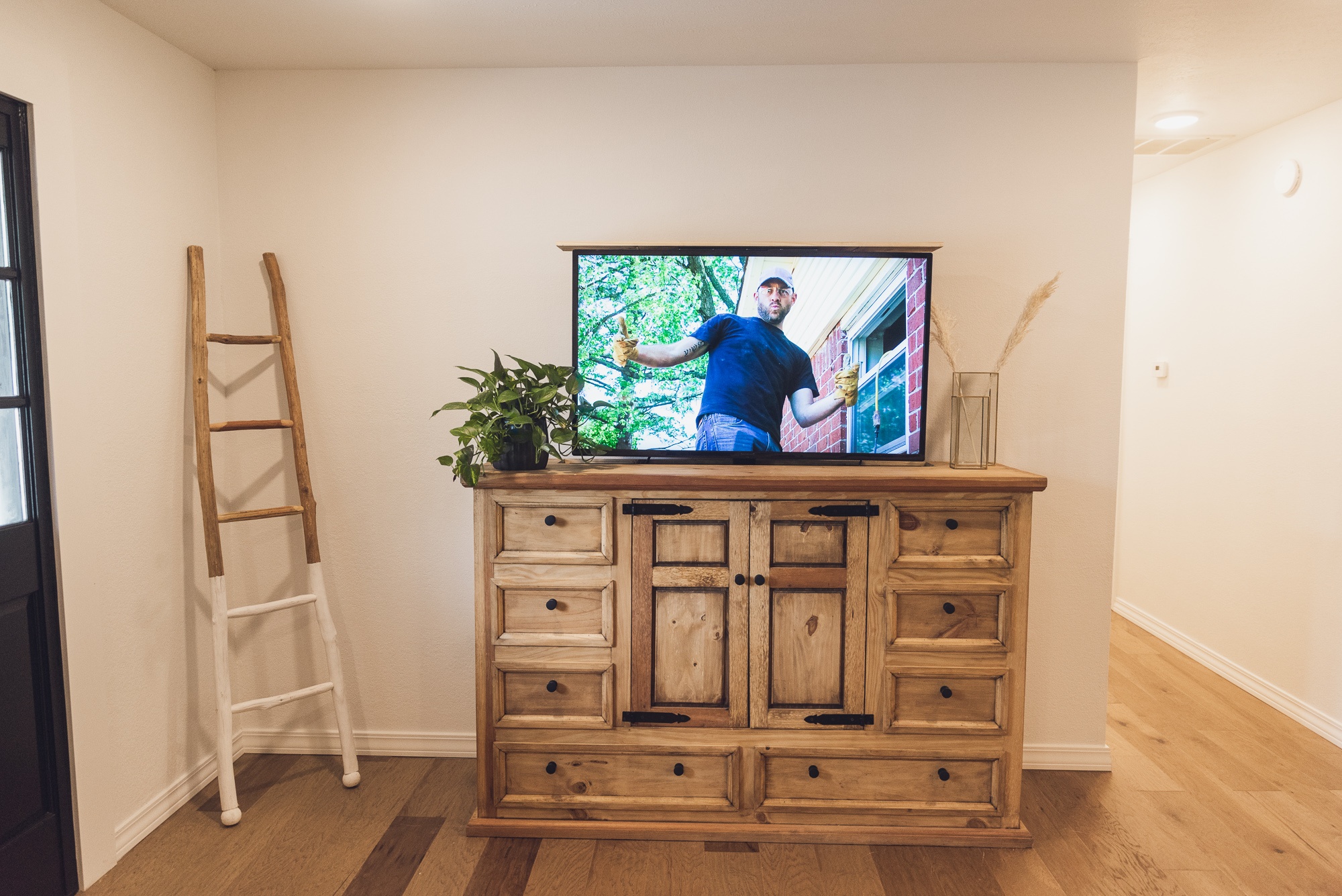 HGTV Fixer to Fabulous cabinet that houses a hidden tv.
