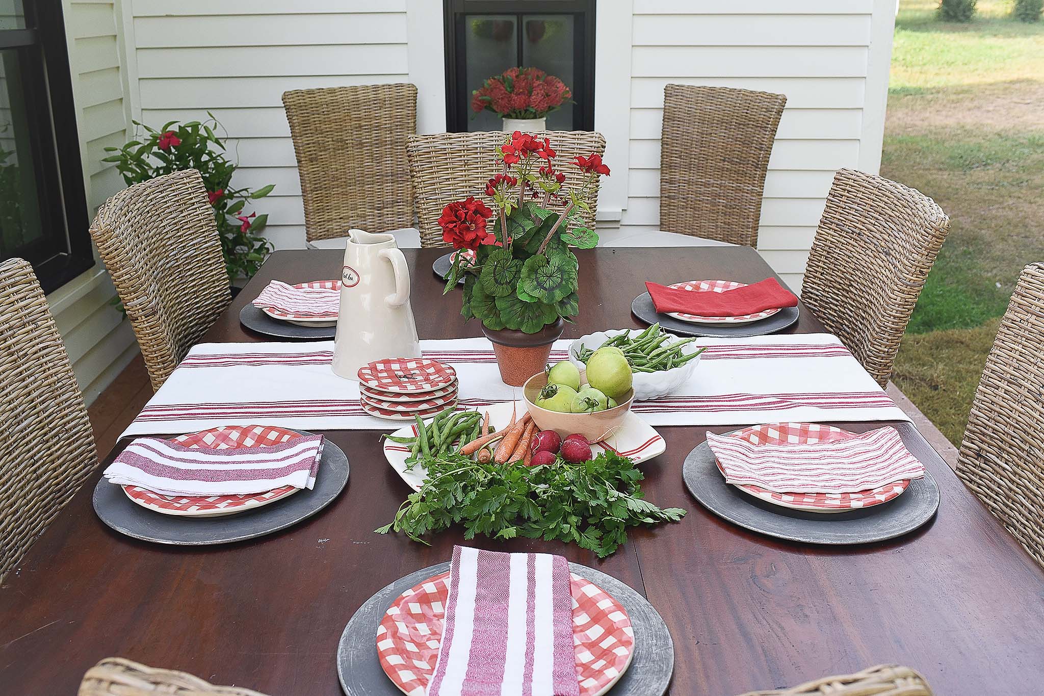 Farmhouse deck with outdoor dining space on HGTV Fixer to Fabulous.