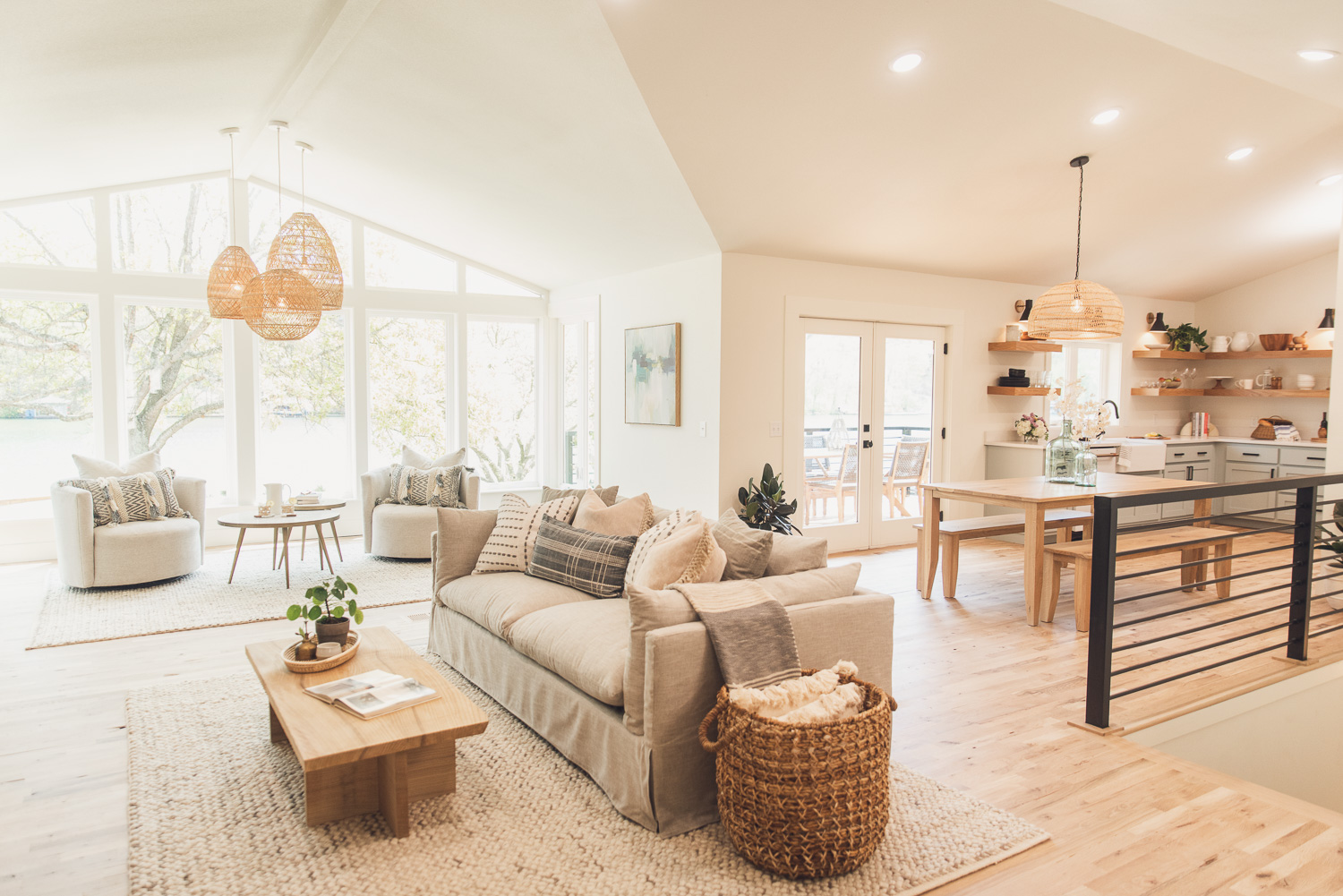 HGTV Fixer to Fabulous Lake house living room, dining room, and kitchen view.