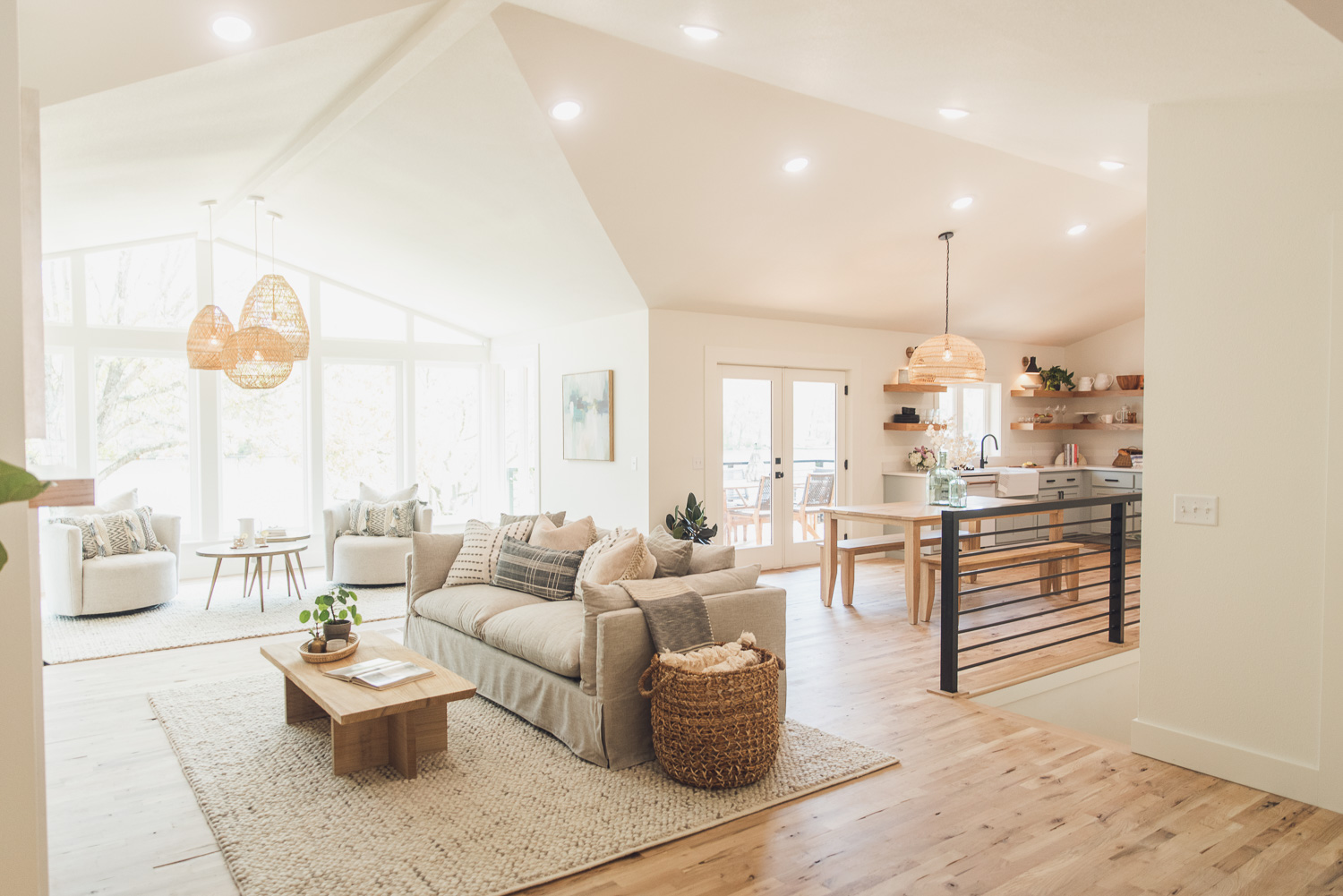 HGTV Fixer to Fabulous Lake house living room, dining room, and kitchen view.