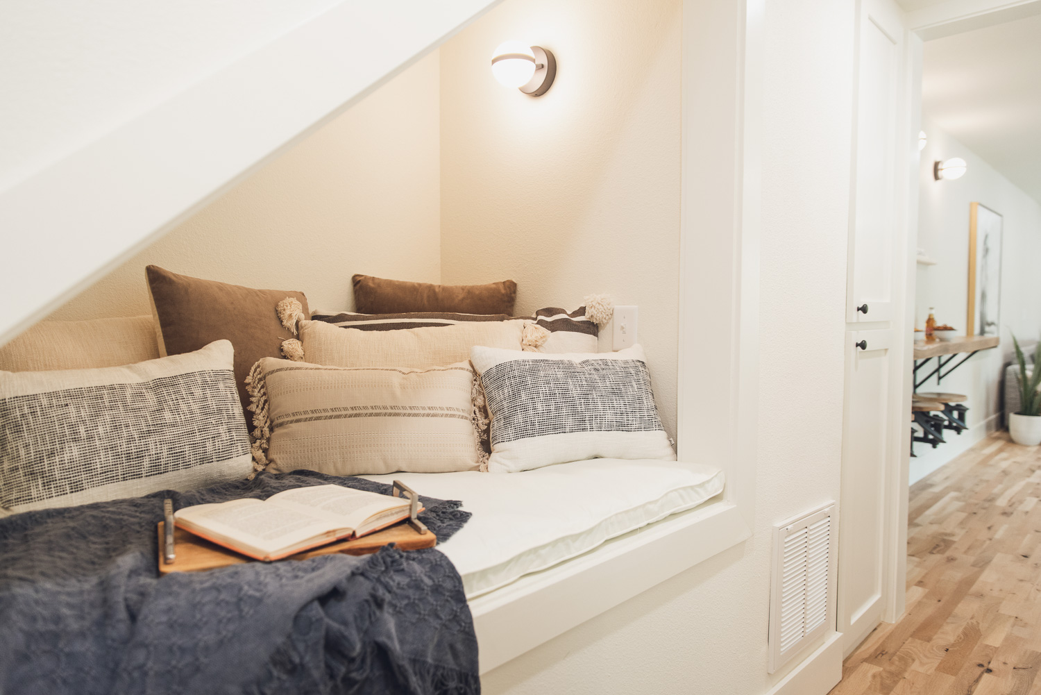 HGTV Fixer to Fabulous Built in Reading Nook under the Stairs.