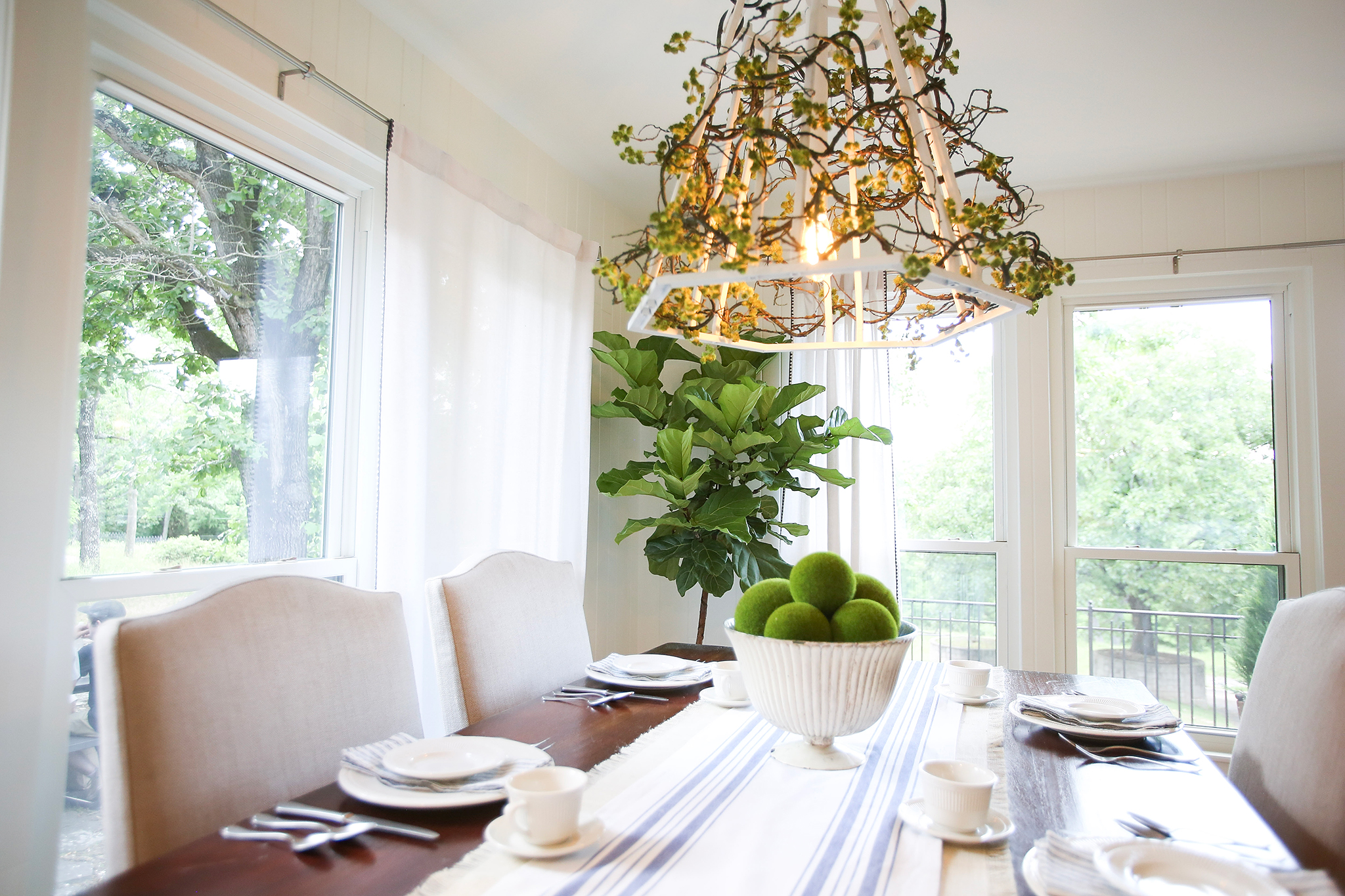 Chandelier made from repurposed old iron balconies on HGTV Fixer to Fabulous.