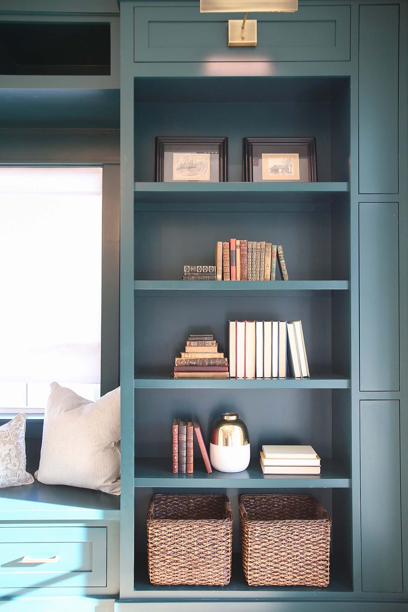 Custom built book case and window seat round out this home office renovation on HGTV Fixer to Fabulous.