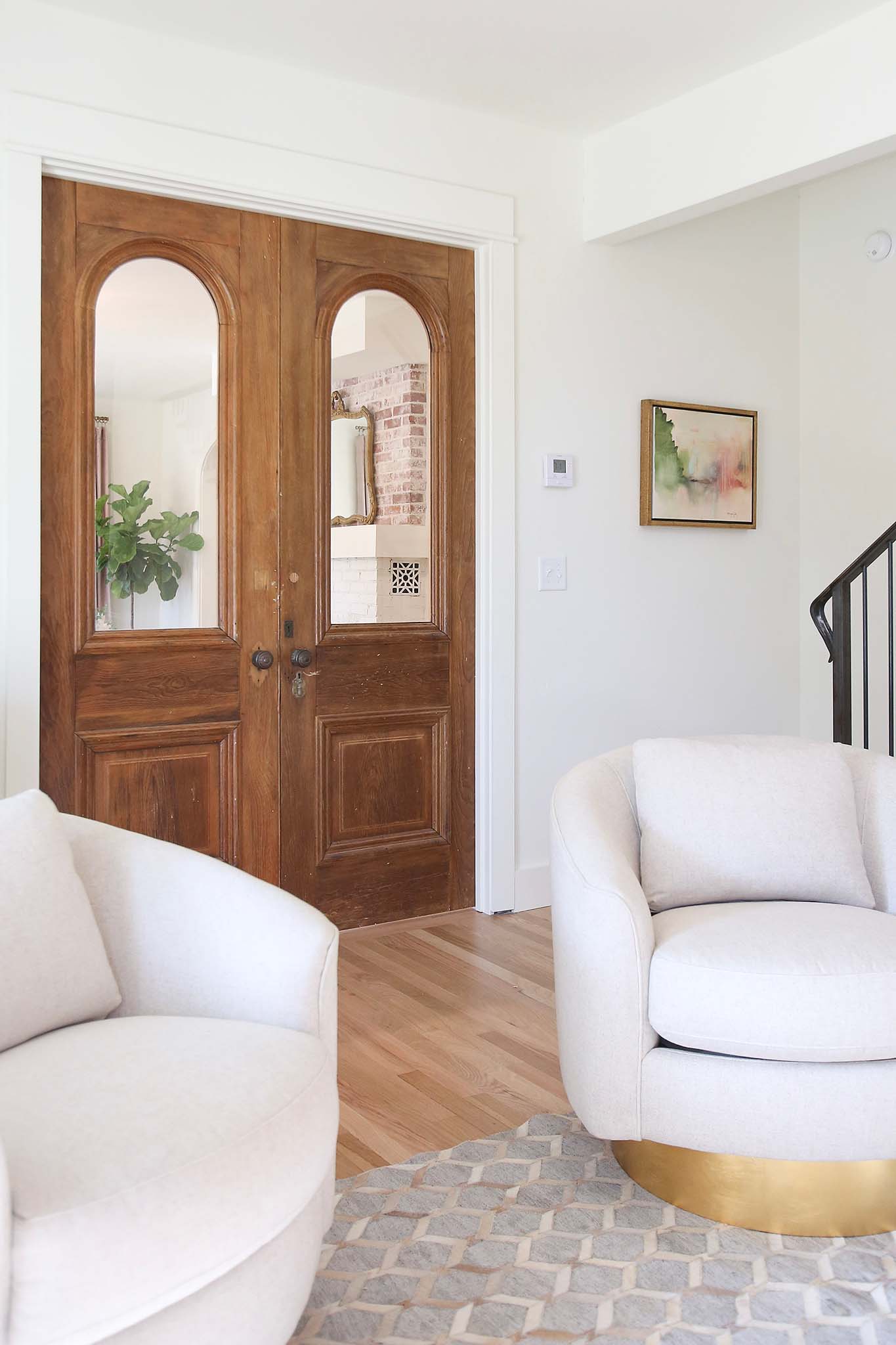 Refurbished antique doors make the perfect french door entry into this home office renovation.