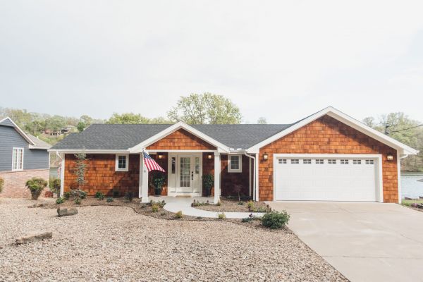 HGTV Fixer to Fabulous Season 2. Exterior lake house view with shake siding.